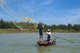 Vietnam: A fisherman casts his net on the Thu Bon River near Hoi An