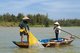 Vietnam: A fisherman casts his net on the Thu Bon River near Hoi An